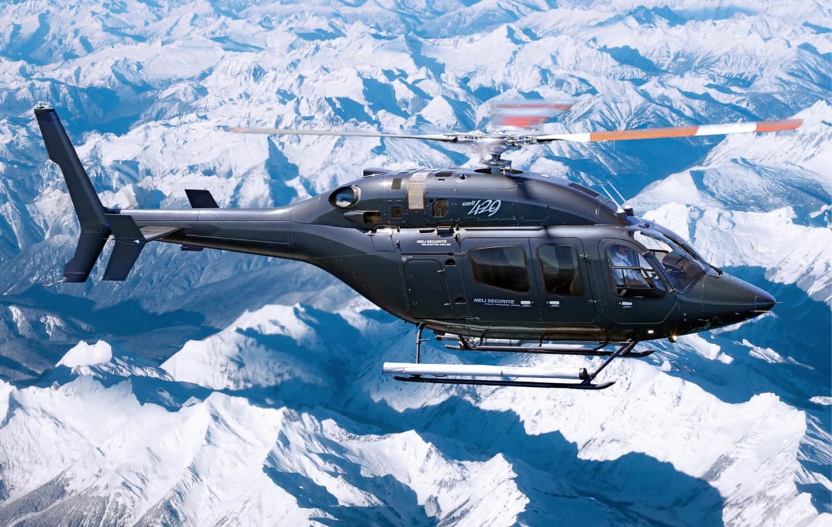 Bell 429 Héli Sécurité — en vol au-dessus des Alpes enneigées