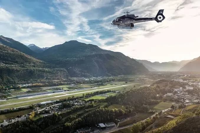 H130 Héli Sécurité survolant Sion