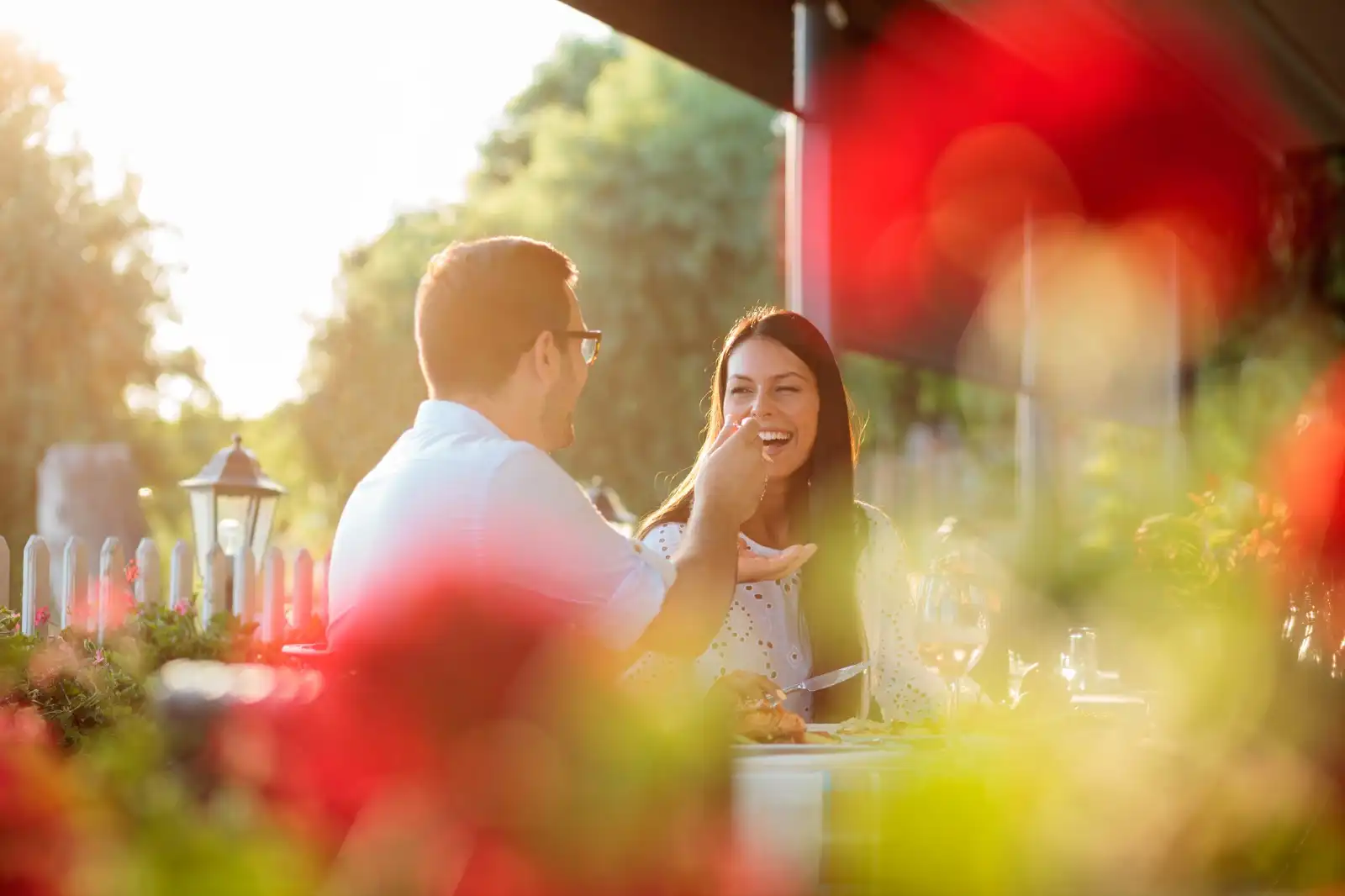 Couple enjoying a gourmet meal during a HELI SECURITE experience